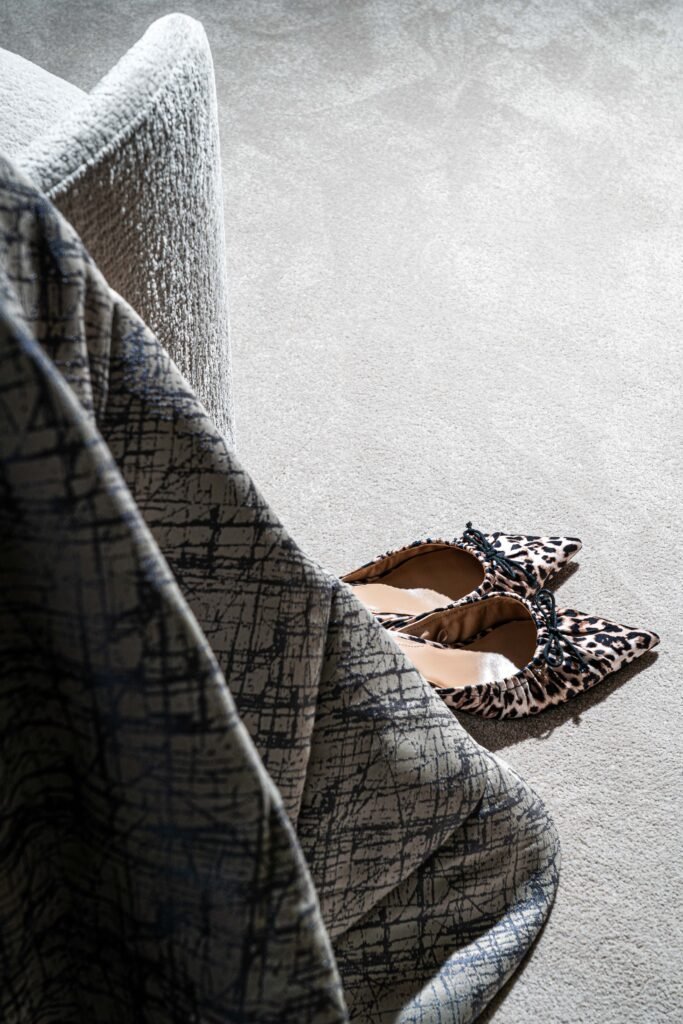 Leopard print shoes on a light carpet beside the bed – Youghal Residential, AK Interior, Cork