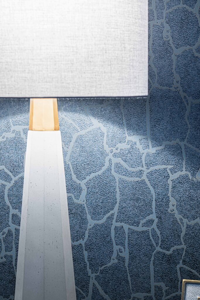 Modern table lamp shade in front of blue textured wallpaper – Youghal Residential, AK Interior, Cork