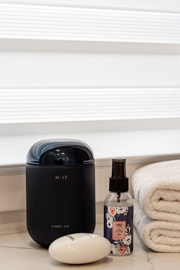 Minimal bathroom accessories with towels and cosmetic products – Monkstown Full House Design by AK Interior.
