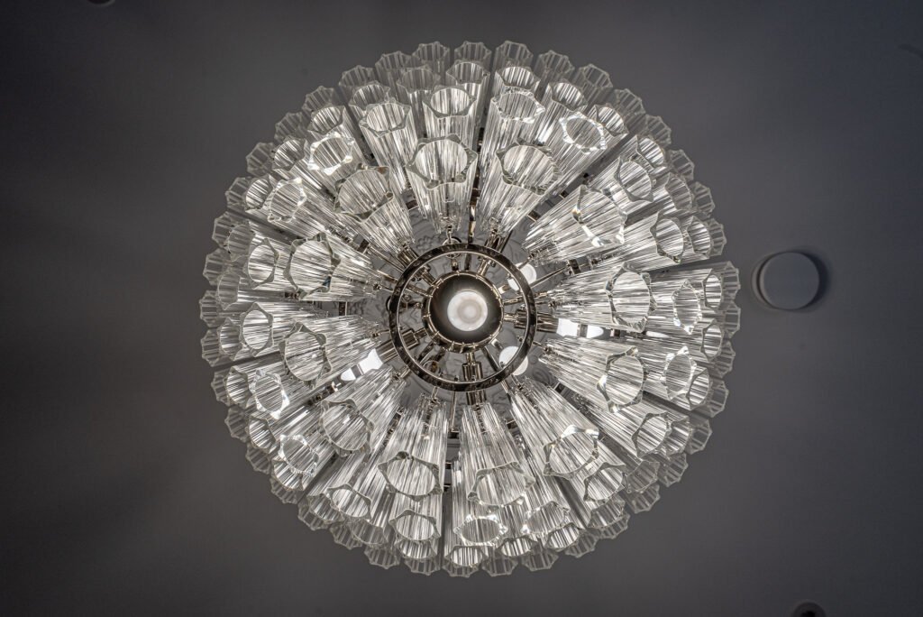Close-up of the underside of a crystal chandelier showing its structure – AK Interior, Monkstown Full House Design