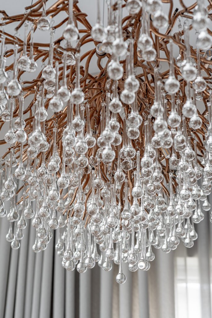 Close-up of crystal chandelier details. Project Monkstown Full House Design – AK Interior.
