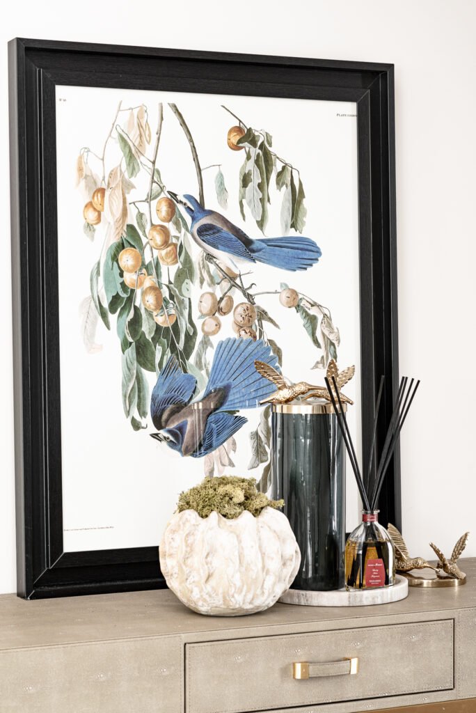 Console table styling with artwork, fragrance diffuser, and sculptural accessories. Project Monkstown Full House Design – AK Interior.